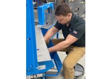 Anthony repairs a US-2000 Bander machine 