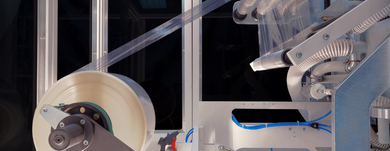 shrink wrapping material and machine