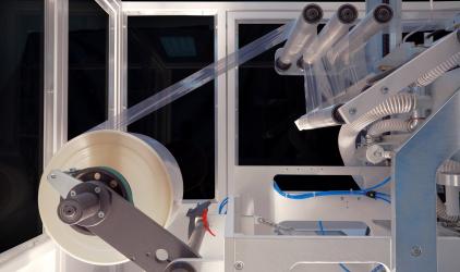 shrink wrapping material and machine