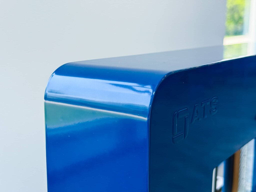 Top corner of the ATS-branded Felins US-3000 banding machine showing its sleek, modern blue exterior.